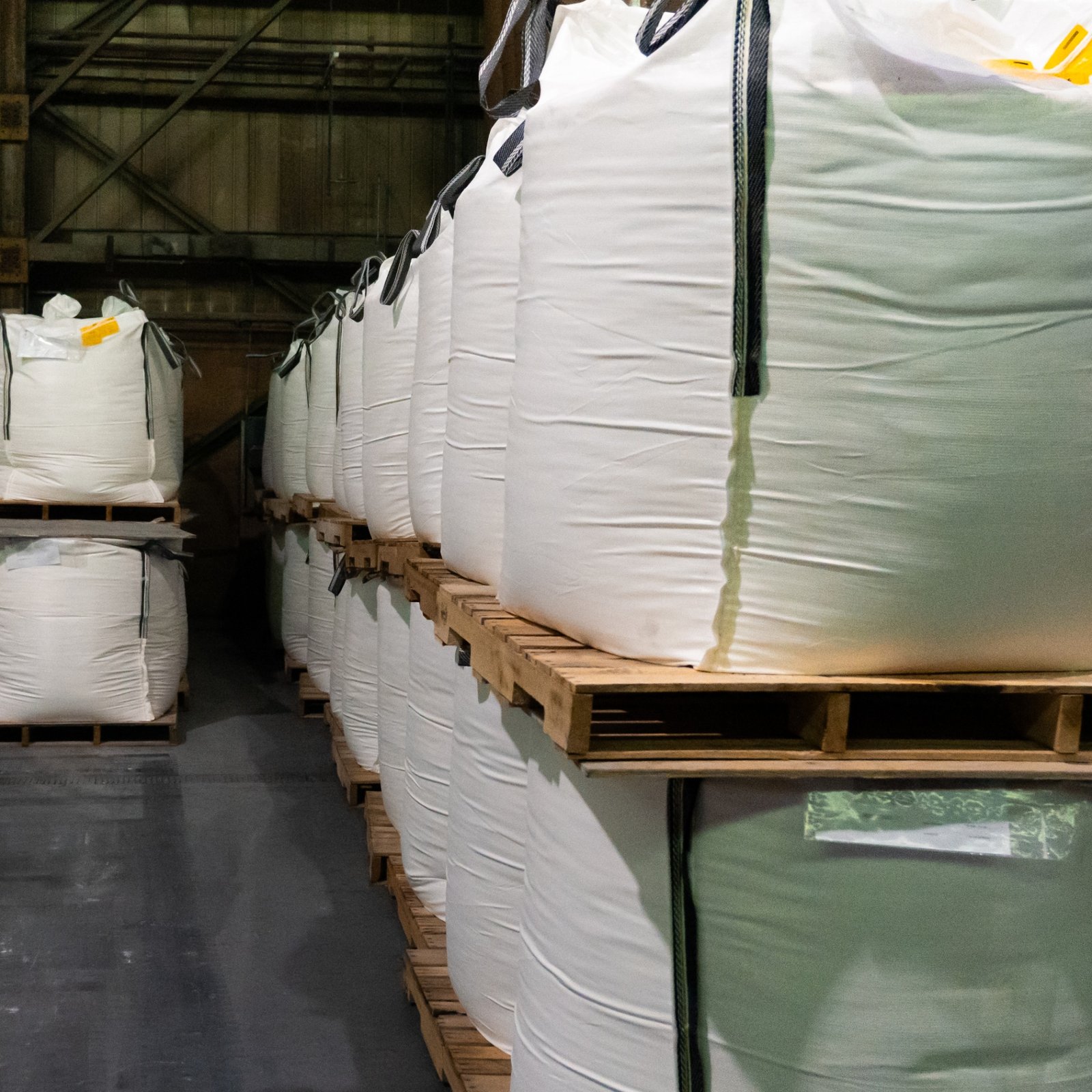 Hand scooping powder during repackaging at the NBN facility