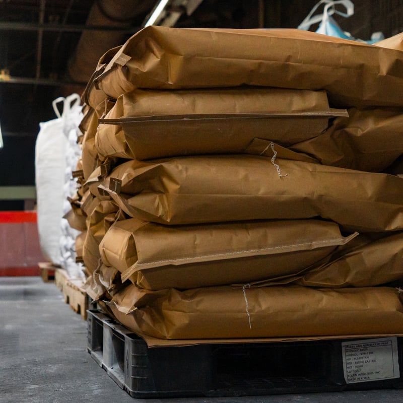 Open-mouth bagger filling production bags